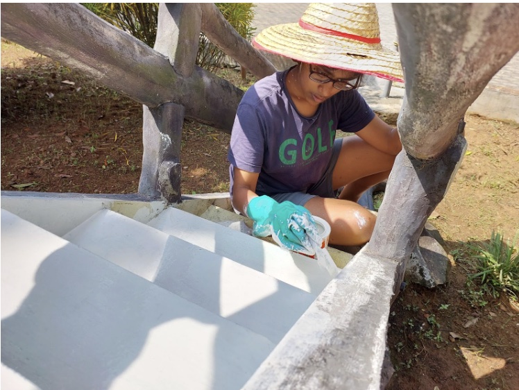 Painting outdoor steps during the Eagle project