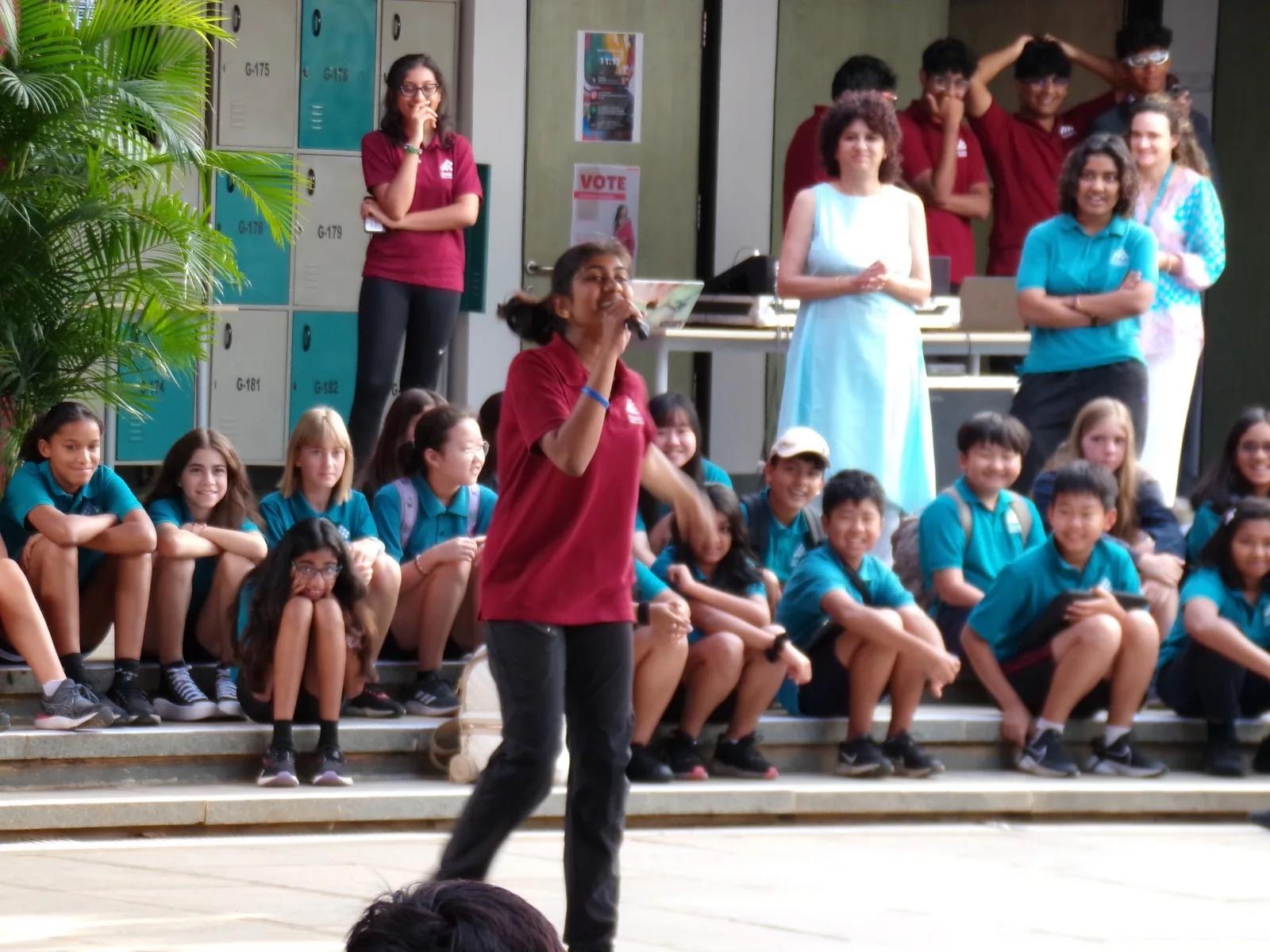 Performing a student council campaign rap at school